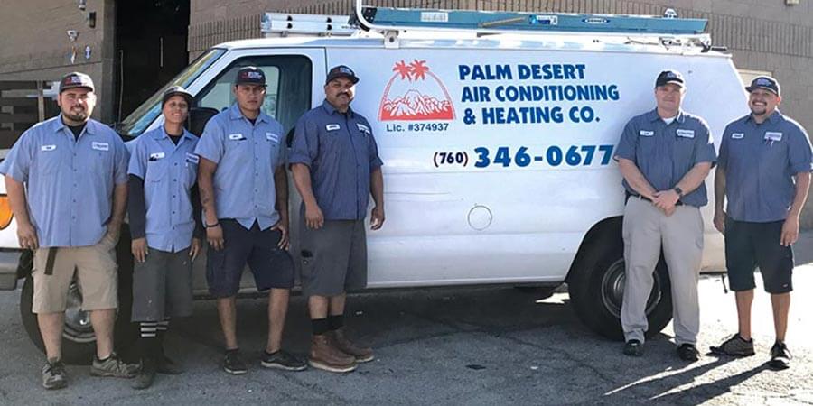 Palm Desert Air Conditioning and Heating Co. team standing in front of a service truck