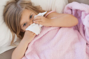 Sick Girl Is Blowing Nose With Tissue